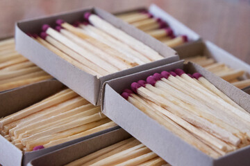 Several boxes filled with matches, a close-up shot. Matchboxes.