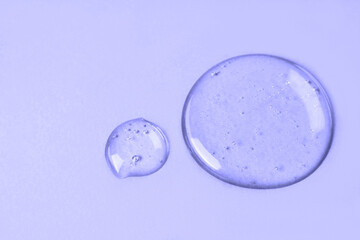 Liquid gel or drop of serum. Gel and cosmetic texture. Drops of liquid transparent gel