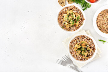 Buckwheat porridge with roasted mushrooms in white bowl