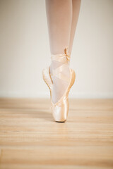 Caucasian mother dancing classical ballet at home