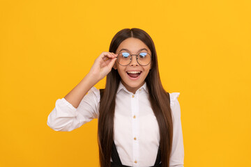 amazed teen girl in school uniform and glasses for vision protection, eyewear