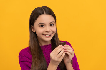 Fototapeta premium Happy girl child enjoy eating chocolate snack yellow background, tasty