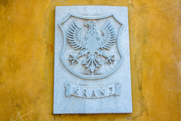 Coat of arms of Kranj, Slovenia on wall of City Hall