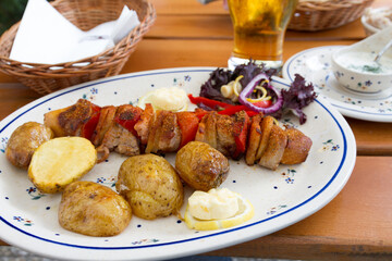 Pork kebab and potatoes