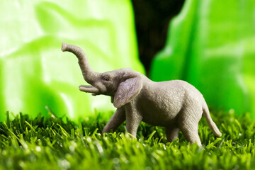 Toy elephant on a natural background
