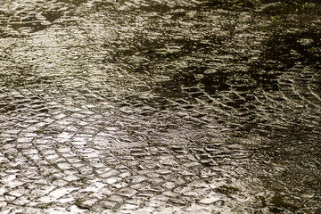 Rain on sett paving