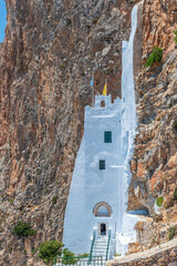 The famous Hozoviotissa Monastery standing on a rock over the Aegean sea in Amorgos island,...