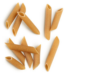 Wolegrain penne pasta from durum wheat isolated on white background with clipping path. Top view with copy space for your text. Flat lay,