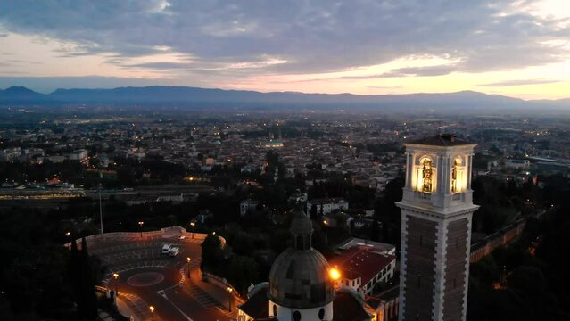 Aerial view of Monte Berico and Piazzale della Vittoria at sunrise, with a view of Vicenza  - Drone