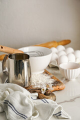 Easter culinary background. Easter food ingredients composition on the kitchen table and copy space for a text menu or recipe