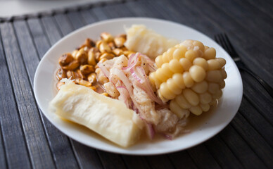 Peruvian traditional dish.fish ceviche with yuka and corn