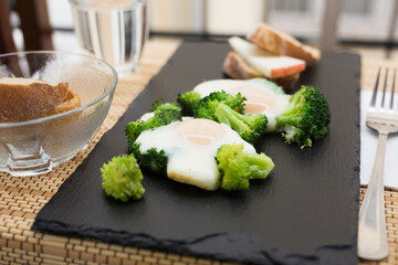 breakfast of crumpled eggs with broccoli