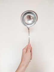 hand holding ladle