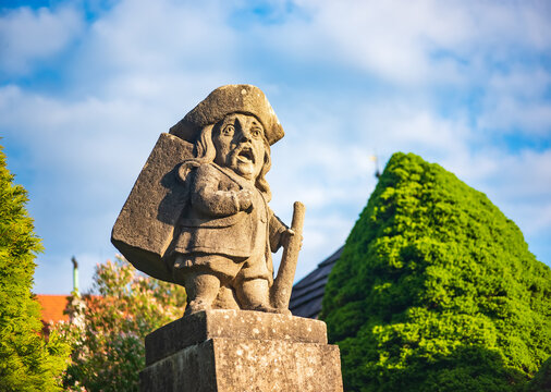 Traveller - baroque stony figure of the Dwarf Cabinet near Castle of Nove Mesto nad Metuji, Czech Republic.
