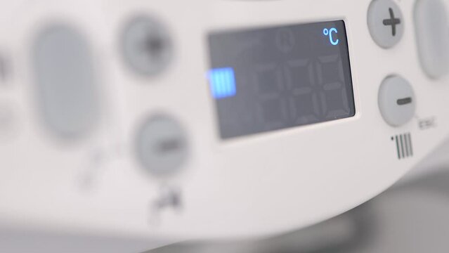 home heating boiler, boiler temperature control, heating hot water radiators electricity / gas consumption, cost increases, bill reading, boiler turned on, house light turned on, high costs