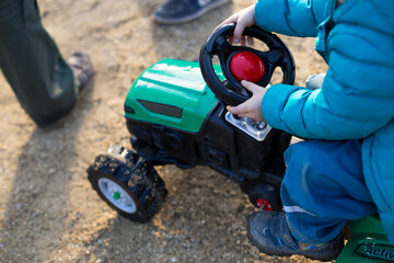 Fototapeta premium boy playing with toy car. High quality photo