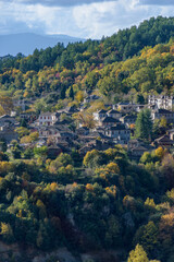 View of the traditional village Mikro Papigo with with the famous stone buildings during  fall season in  zagori Greece