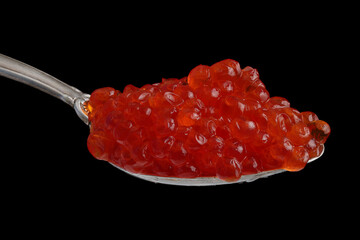 Red caviar in an old silver spoon