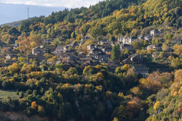 View of the traditional village Mikro Papigo with with the famous stone buildings during  fall season in  zagori Greece