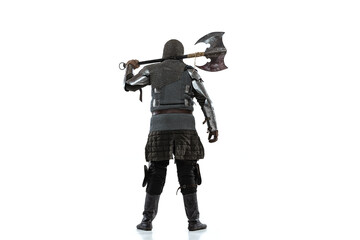 Portrait of brutal brave man in costume of medieval warrior, knight posing isolated over white studio background. Back view - obrazy, fototapety, plakaty