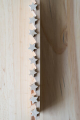 Obraz na płótnie Canvas small wooden stars on a wooden object