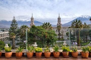 The main square of the city and a view of the Andes. Arequipa, Peru.