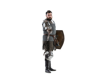 Portrait of seriuos man, medieval warrior or knight with sword and shield in special chain armour...