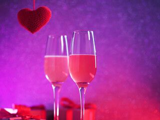 Romantic Valentine's day card. Two glasses of wine or cider, a red knitted heart and gift boxes. Neon backlight