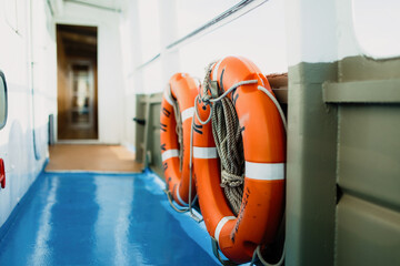 Two orange inner tubes on a blue deck of a boat. Safety measures at the vessel. Ship. Inflatable....