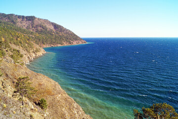 The steep shore of Lake Baikal on a sunny day