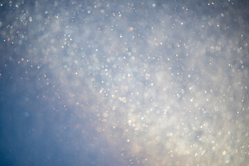Frost and snow particles floating through the air in fog