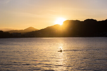 Canoe at sunset in the La Concha bay of San Sebastian