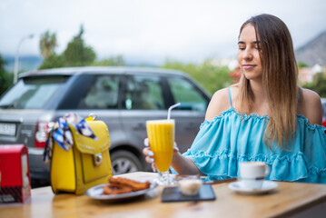 Girl sitting at a churros cafe