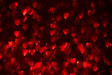 Red hearts, sparkling glitter bokeh background, valentines day abstract defocused texture