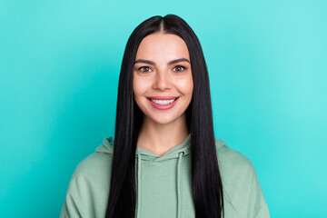 Photo of cute millennial black hairstyle lady wear green hoodie isolated on teal color background