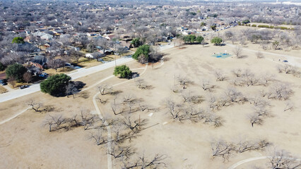 Top view large park with pathways and trails near residential neighborhood outside of Downtown...