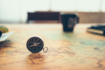 Fototapeta na wymiar Magnetic compass on world map. Travel , Adventure and Discovery concept.
