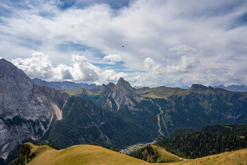 Beautiful view of Canazei with the Marmolada and Colac peaks. Dolomites.