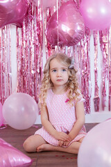 A girl's birthday, festive decorations, balloons, pink coffees.