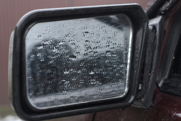 car glass with raindrops 