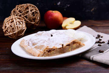 Piece of apple pie served with ice cream, fruit baking
