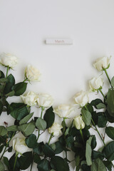 8 March, Woman Day background with white roses and place for text on white background top view
