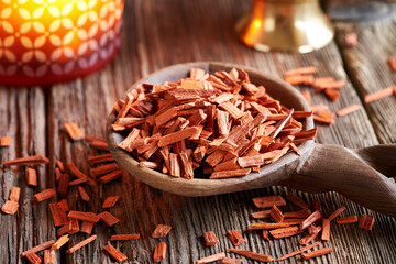 Red sandalwood on a wooden spoon