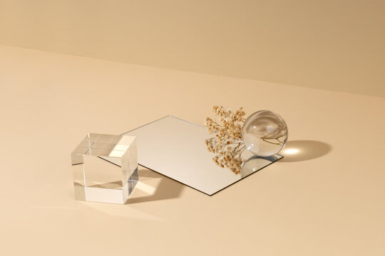 Skincare product showcase stand photography for online marketing include crystal ball and crystal cube stand on beige background