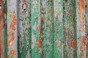 Interesting painted old metal surface with traces of rust, scratches and time damage texture