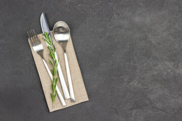 Set of cutlery on linen napkin. - obrazy, fototapety, plakaty
