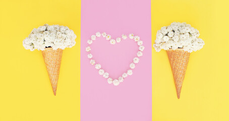 Ice cream cone with flowers and heart shaped petals on colorful pink background, top view, flat lay