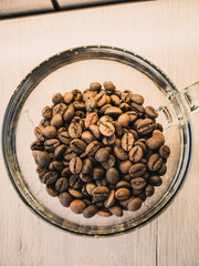 coffee beans in a wooden spoon