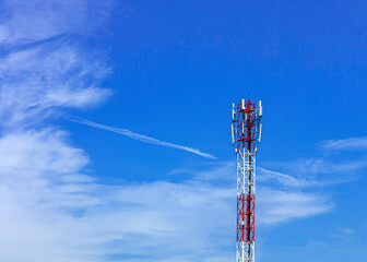 Telecommunication telephone signal transmission tower with beautiful blue sky