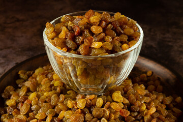 Pile of Organic dried Raisins on black background